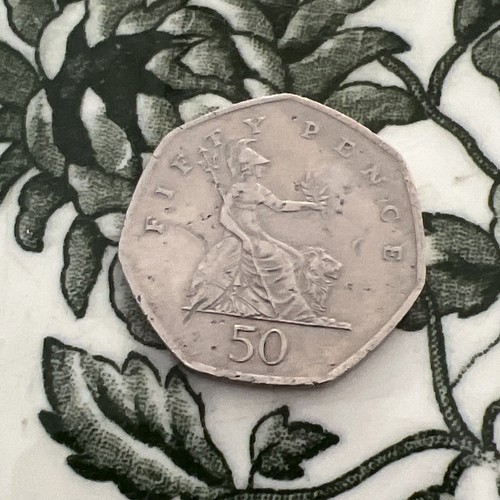 British pence coin - 50,