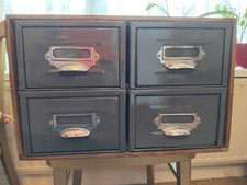 A UNIT OF 4 VINTAGE METAL INDEX STORAGE DRAWERS, MADE INTO A 4 DRAWER CABINET