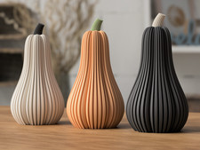 Ribbed Pumpkins Ornament –