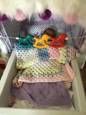 VINTAGE ELASTICATED RATTLE PRAM TOY - ROCKING HORSES