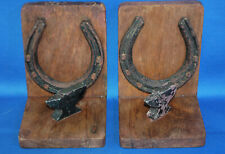 A pair of antique handmade horseshoe and anvil bookends, wood and metal, farrier