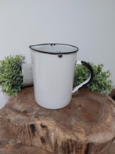 A White Enamel Measuring Jug