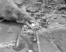 Wind wafts smoke from burning