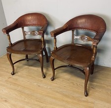Pair of Victorian mahogany and leather library desk chairs  
