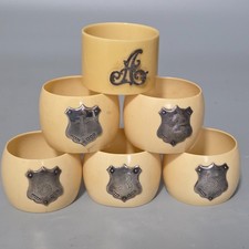 6 x vintage celluloid / early bakelite and silver napkin rings