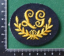 British Army Cloth Trade and Qualification Badge LG in Wreath - Yellow on Blue