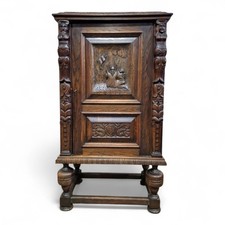 Antique carved oak side cabinet /  heavily carved freestanding storage cupboard