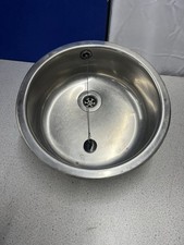Round stainless steel sink with plug