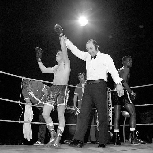 Referee john coyle raises arm - coyle,