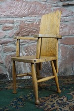A Vintage Child's Wooden School Chair With Metal Reinforcement