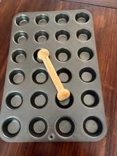 The Pampered chef mini muffin 24 pan with wooden tart shaper