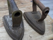 2 x vintage flat irons sunflower motif & club/diamond  cast iron doorstops?  #8