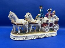 Vintage porcelain horse drawn carriage, 24 cm long.