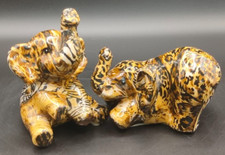 x2 Ceramic Elephants wood finish in  very good displayed condition