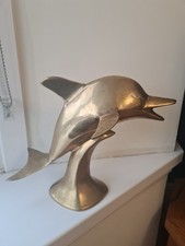 Dolphin Leaping On A Wave