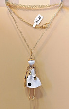 MC 25-designer inspired gold tone doll figure hand bag n/l white dress necklace