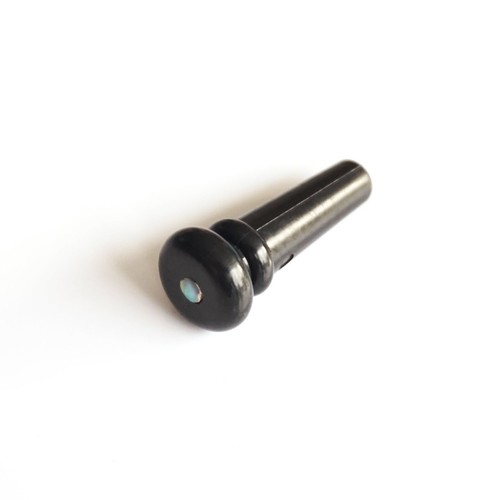 Black acoustic guitar end - end, pin