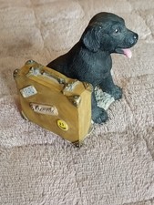 Small black Labrador statue