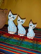 SET OF THREE HAND CARVED