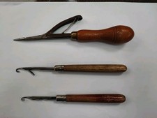 THREE VINTAGE RUG MAKING TOOLS