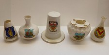Crested China Ware: five different pieces featuring towns from Wales
