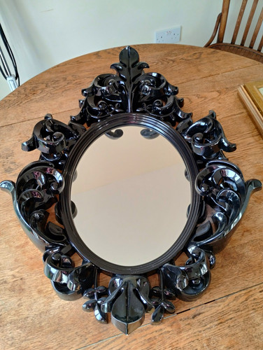 Ornate black oval framed wall - framed,