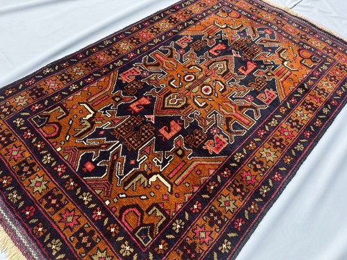 Brown hand knotted afghan - hand,