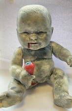 zombie baby doll with severed eyeball halloween horror prop party haunted house