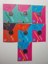bundle of 7 Royal Mint Carded Olympic 2012 50p Coins including judo wrestling...