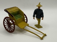 Metallic Rickshaw and Man by