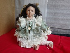 Leonardo Collection Porcelain Doll Hannah, Sitting , Green Dress,12''