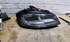 Audi A3 8P 2009 Drivers Right Halogen Headlight Black Background.