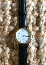Timex Ladies Indiglo 25mm Gold Tone Backlit Dial Black Leather Strap Watch
