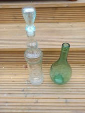 Two Very Nice Bottles And A Jack Daniels Tin.