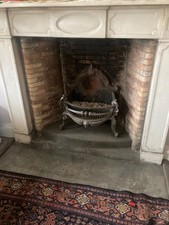 Antique fire grate adapted to