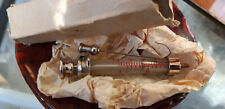 Vintage metal and glass hypodermic syringe and two needle packs - not for use