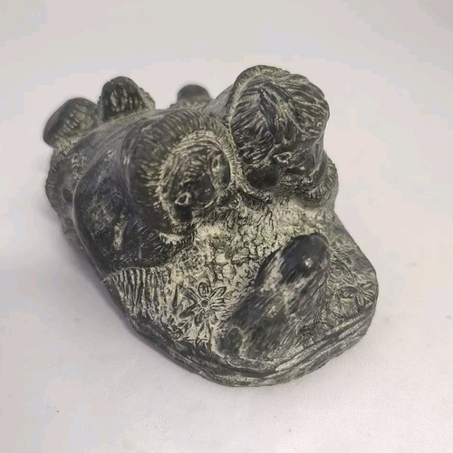 Inuit carving a wolf - carving,
