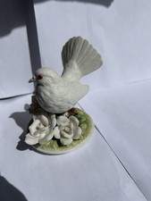 Porcelain Dove Figurine Depicting a White Dove on a Base with Floral Elements