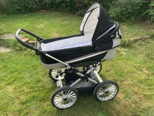 Emmaljunga pram, used condition, black with black/white check panels. 