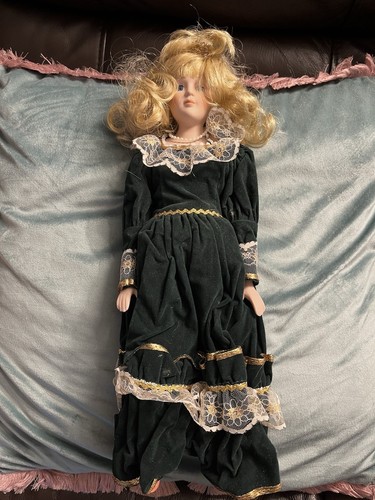 Porcelain doll used over - over, 30