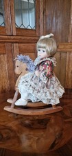 Porcelian Doll On Rocking