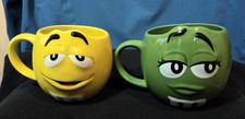 2 Large M&M World 3D Ceramic Tea And Coffee Mugs, Simply Yellow  & Ms. Green