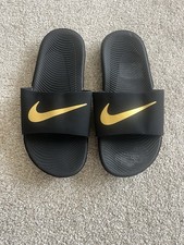 Boys black and gold Nike