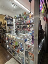 tall glass display cabinet with 4 glass shelves