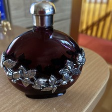 purple glass perfume bottle with white metal sp? design & top 9cm tall 8cm long