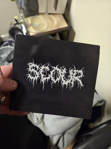 Scour grey - by,