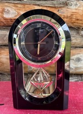 VIntage Rhythm Quartz Japan Black Mantel Clock with a spinning diamond pendulum