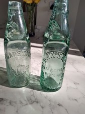GLASS 'CODD' BOTTLES WITH MARBLE STOPPERS (TWO BOTTLES)