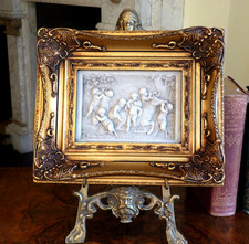 Gold frame Cherub relief wall