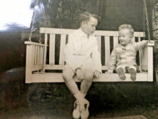 swing rocking chair on porch child's earnest conversation 1954  PORTRAIT  9/13cm